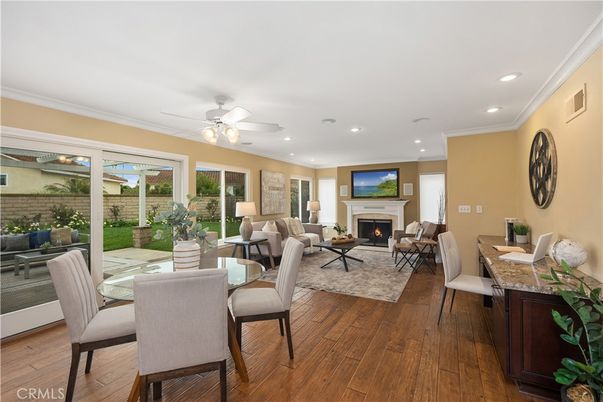 Dining room, Fireplace, Interior, Living room, Recessed Lighting, Wood Texture Flooring