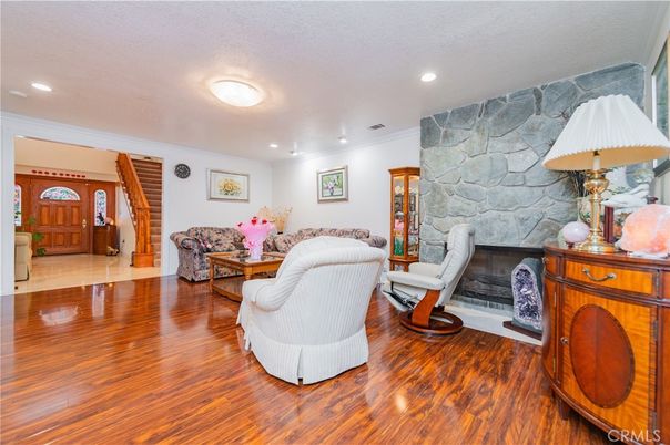 Fireplace, Interior, Living room, Recessed Lighting, Stone Walls, Wood Texture Flooring