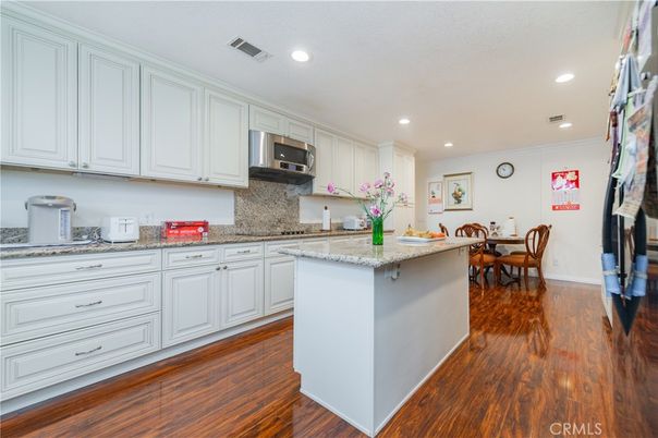 Dining room, Interior, Kitchen, Recessed Lighting, Stainless Steel Appliances, Wood Texture Flooring