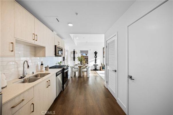 Dining room, Interior, Kitchen, Recessed Lighting, Stainless Steel Appliances, Wood Texture Flooring