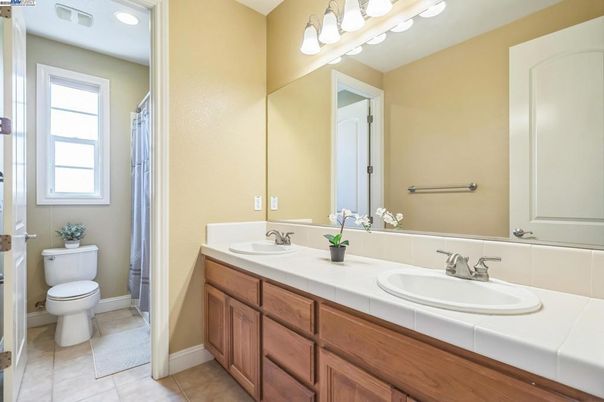 Bathroom, Dual Sink Vanities, Interior, Recessed Lighting, Tile Countertops