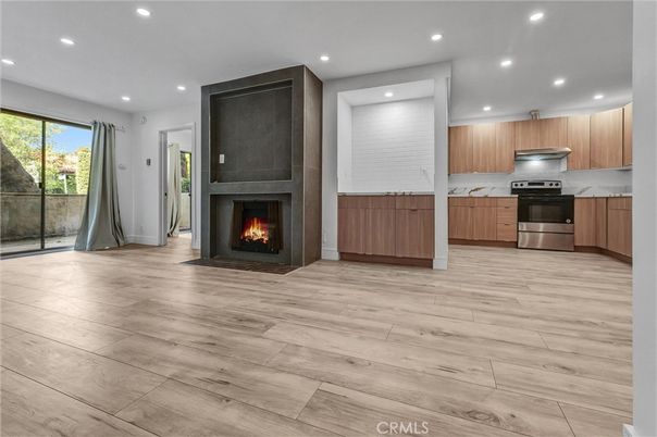 Fireplace, Interior, Kitchen, Recessed Lighting, Stainless Steel Appliances, Wood Texture Flooring