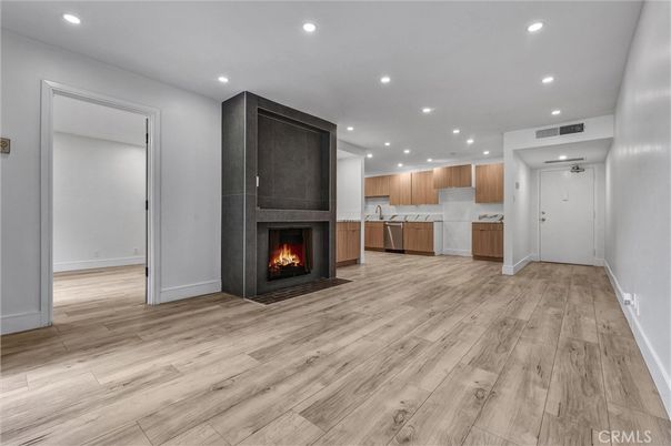 Empty room, Fireplace, Interior, Kitchen, Recessed Lighting, Wood Texture Flooring