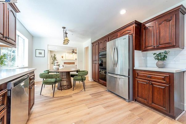 Dining room, Interior, Kitchen, Recessed Lighting, Stainless Steel Appliances, Wood Texture Flooring