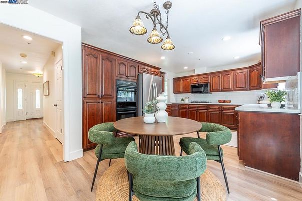 Dining room, Interior, Kitchen, Pendant Lights, Recessed Lighting, Stainless Steel Appliances, Wood Texture Flooring