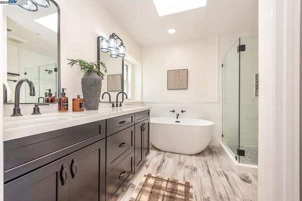 Bathroom, Dual Sink Vanities, Free Standing Baths, Glass Shower, Interior, Recessed Lighting, Wood Texture Flooring