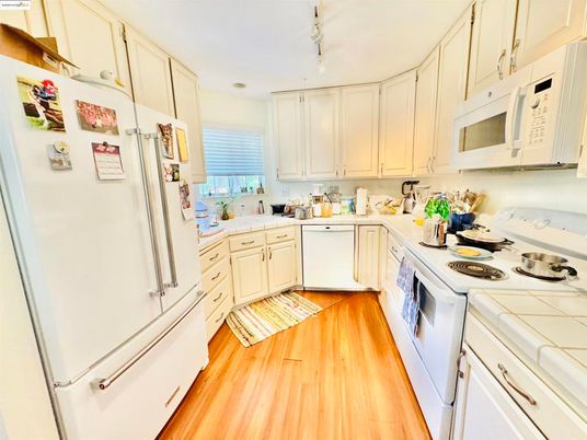 Interior, Kitchen, Tile Countertops, Wood Texture Flooring