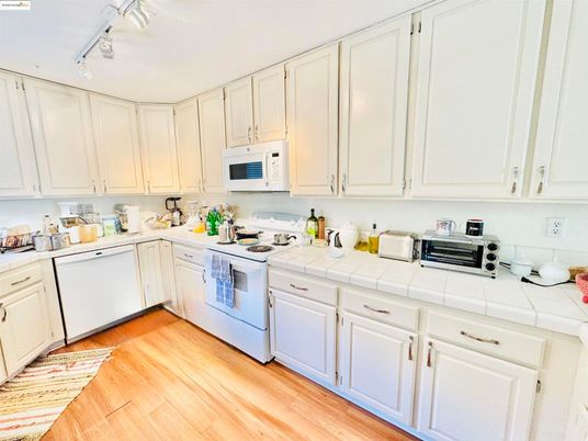Interior, Kitchen, Tile Countertops, Wood Texture Flooring
