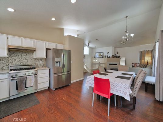 Chandelier, Dining room, Interior, Kitchen, Pendant Lights, Recessed Lighting, Stainless Steel Appliances, Wood Texture Flooring