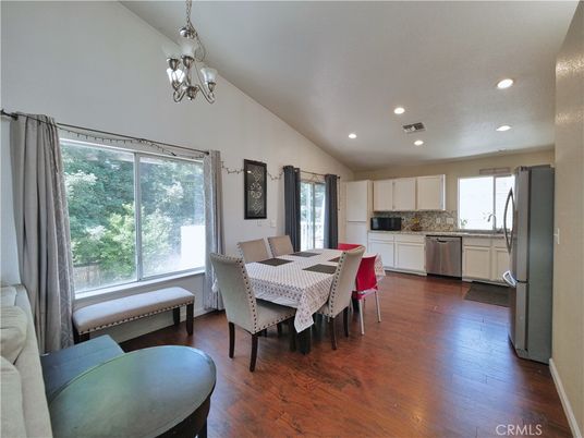 Chandelier, Dining room, Interior, Kitchen, Recessed Lighting, Stainless Steel Appliances, Wood Texture Flooring