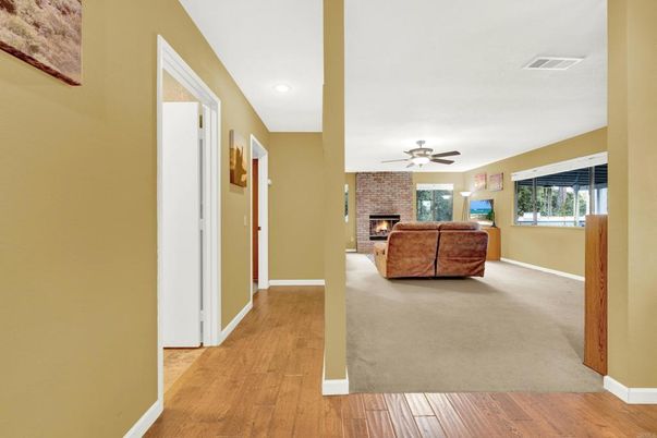 Fireplace, Interior, Living room, Recessed Lighting, Stone Walls, Wood Texture Flooring