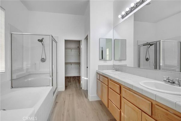 Bathroom, Dual Sink Vanities, Glass Shower, Interior, Tile Countertops, Wood Texture Flooring