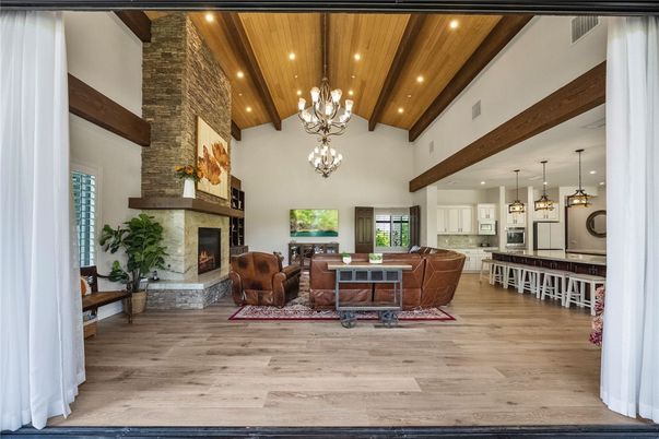 Chandelier, Dining room, Fireplace, Interior, Kitchen, Living room, Pendant Lights, Recessed Lighting, Stone Walls, Wooden Beams, Wooden Ceilings, Wood Texture Flooring