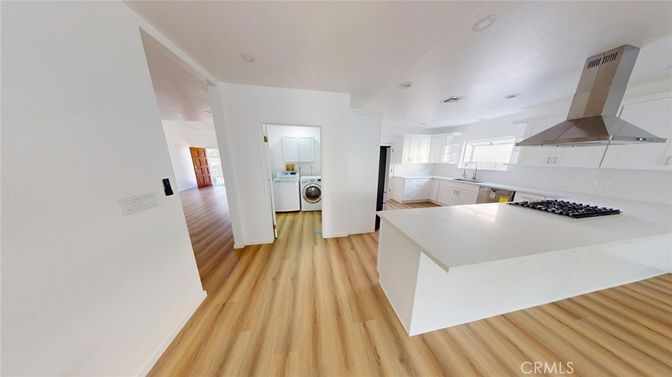 Interior, Kitchen, Recessed Lighting, Washer, Wood Texture Flooring