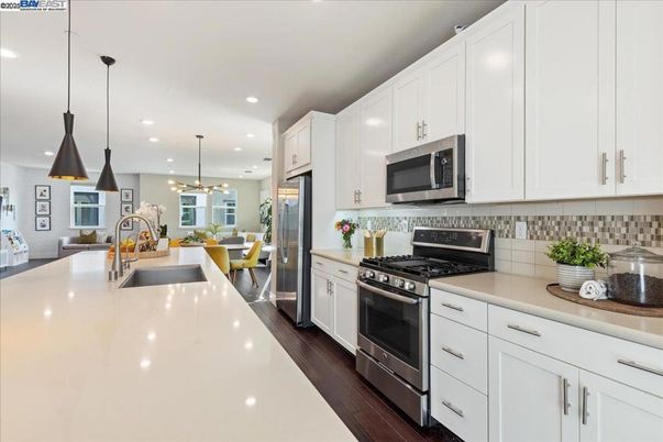 Dining room, Interior, Kitchen, Pendant Lights, Recessed Lighting, Stainless Steel Appliances, Wood Texture Flooring