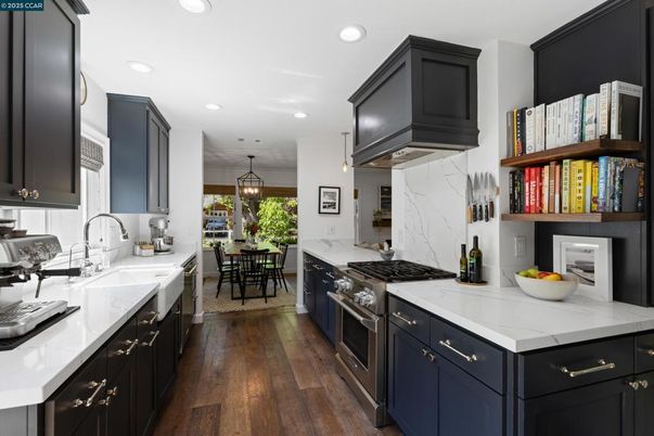 Dining room, Interior, Kitchen, Marble Walls, Pendant Lights, Recessed Lighting, Stainless Steel Appliances, Wood Texture Flooring