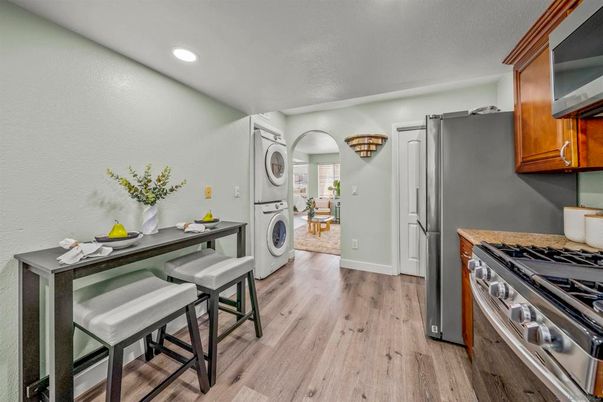 Interior, Kitchen, Recessed Lighting, Washer, Wood Texture Flooring
