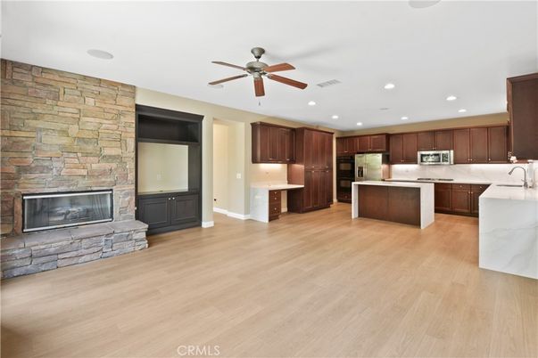 Fireplace, Interior, Kitchen, Recessed Lighting, Stone Walls, Wood Texture Flooring