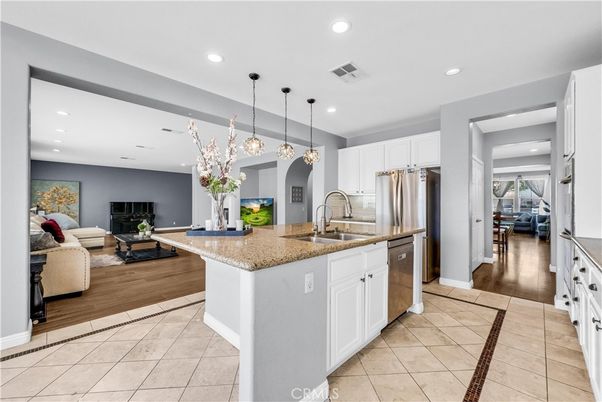 Fireplace, Interior, Kitchen, Living room, Pendant Lights, Recessed Lighting, Stainless Steel Appliances, Wood Texture Flooring