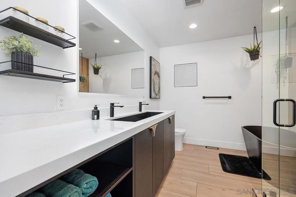 Bathroom, Dual Sink Vanities, Free Standing Baths, Glass Shower, Interior, Recessed Lighting, Wood Texture Flooring