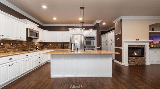 Fireplace, Interior, Kitchen, Pendant Lights, Recessed Lighting, Stainless Steel Appliances, Wood Texture Flooring