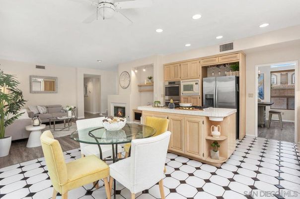 Dining room, Fireplace, Interior, Kitchen, Living room, Recessed Lighting, Stainless Steel Appliances, Wood Texture Flooring
