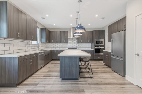 Interior, Kitchen, Pendant Lights, Recessed Lighting, Stainless Steel Appliances, Wood Texture Flooring