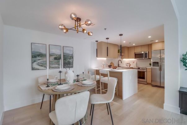 Dining room, Interior, Kitchen, Pendant Lights, Recessed Lighting, Stainless Steel Appliances, Wood Texture Flooring
