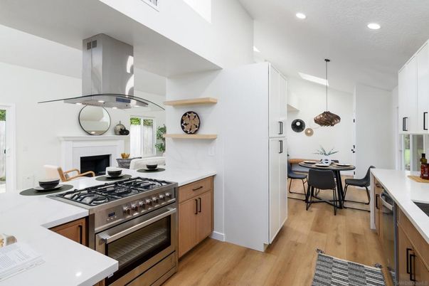 Dining room, Fireplace, Interior, Kitchen, Pendant Lights, Recessed Lighting, Stainless Steel Appliances, Wood Texture Flooring