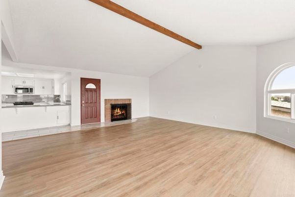 Empty room, Fireplace, Interior, Kitchen, Stainless Steel Appliances, Wooden Beams, Wood Texture Flooring