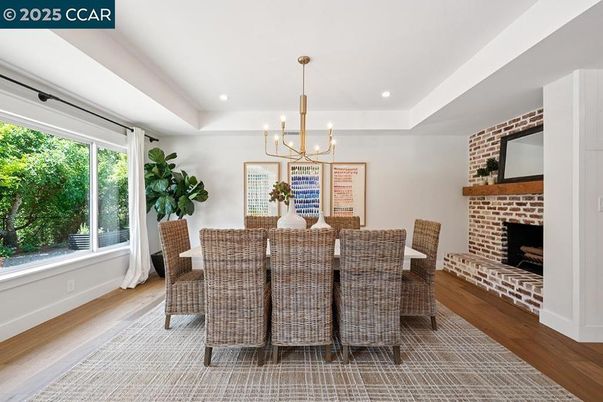Chandelier, Dining room, Fireplace, Interior, Pendant Lights, Recessed Lighting, Stone Walls, Wood Texture Flooring