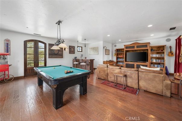 Billiard Table, Game Room, Interior, Living room, Pendant Lights, Recessed Lighting, Wood Texture Flooring