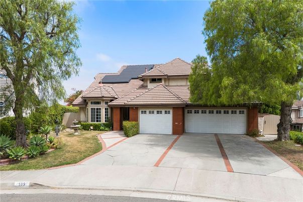 Attached, Exterior, Facade, Brick Facade, Solar Panels, Mediterranean