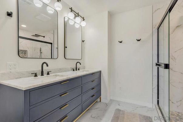 Bathroom, Dual Sink Vanities, Glass Shower, Interior, Marble, Marble Walls, Recessed Lighting