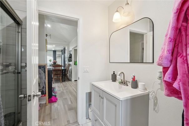 Bathroom, Dining room, Glass Shower, Interior, Recessed Lighting, Wood Texture Flooring