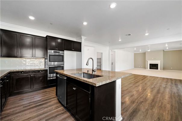 Fireplace, Interior, Kitchen, Recessed Lighting, Stainless Steel Appliances, Wood Texture Flooring
