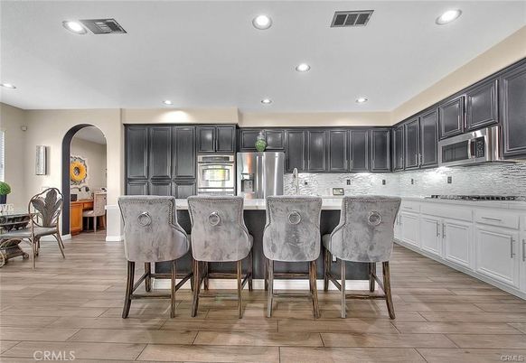 Dining room, Interior, Kitchen, Recessed Lighting, Stainless Steel Appliances, Wood Texture Flooring