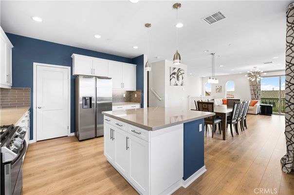 Dining room, Interior, Kitchen, Pendant Lights, Recessed Lighting, Stainless Steel Appliances, Wood Texture Flooring