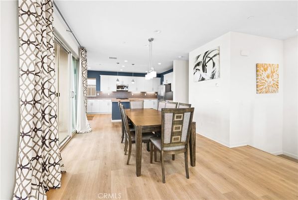 Dining room, Interior, Kitchen, Pendant Lights, Recessed Lighting, Stainless Steel Appliances, Wood Texture Flooring