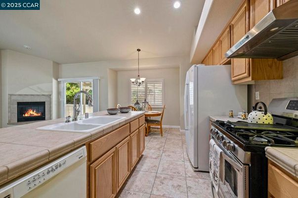 Chandelier, Dining room, Fireplace, Interior, Kitchen, Pendant Lights, Recessed Lighting, Tile Countertops