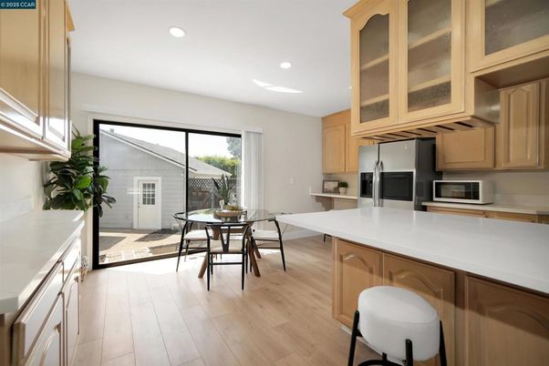 Dining room, Interior, Kitchen, Recessed Lighting, Stainless Steel Appliances, Wood Texture Flooring