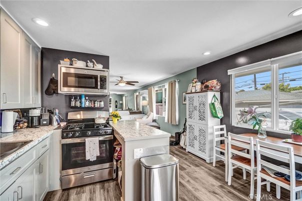 Dining room, Interior, Kitchen, Recessed Lighting, Stainless Steel Appliances, Water, Wood Texture Flooring