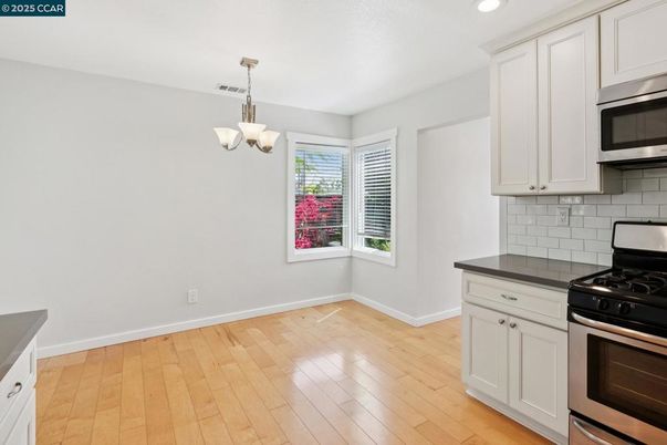 Chandelier, Interior, Kitchen, Pendant Lights, Recessed Lighting, Stainless Steel Appliances, Wood Texture Flooring