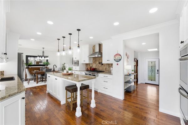 Dining room, Interior, Kitchen, Pendant Lights, Recessed Lighting, Stainless Steel Appliances, Wood Texture Flooring