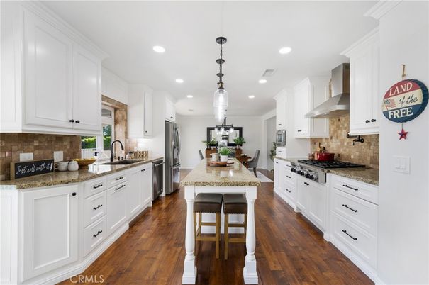 Dining room, Interior, Kitchen, Pendant Lights, Recessed Lighting, Stainless Steel Appliances, Wood Texture Flooring