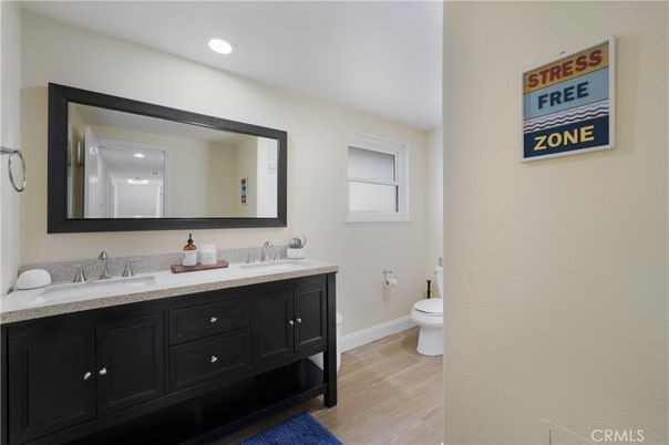 Bathroom, Dual Sink Vanities, Interior, Recessed Lighting, Wood Texture Flooring