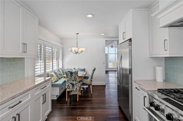 Chandelier, Dining room, Interior, Kitchen, Recessed Lighting, Stainless Steel Appliances, Wood Texture Flooring