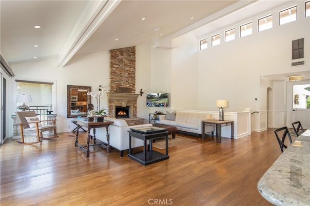 Fireplace, Interior, Living room, Recessed Lighting, Stone Walls, Wood Texture Flooring