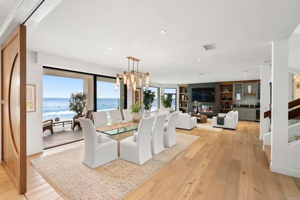 Dining room, Fireplace, Interior, Living room, Pendant Lights, Recessed Lighting, Water, Wood Texture Flooring