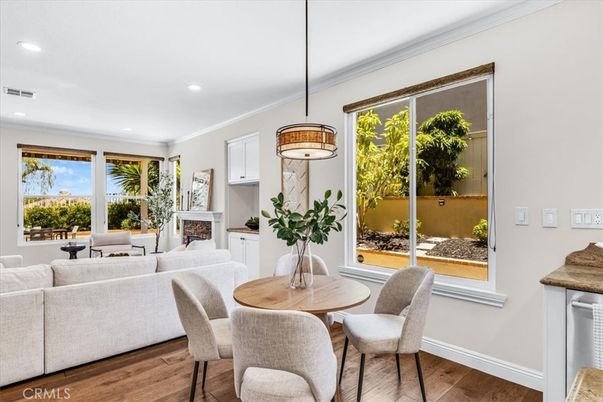 Dining room, Fireplace, Interior, Living room, Pendant Lights, Recessed Lighting, Wood Texture Flooring